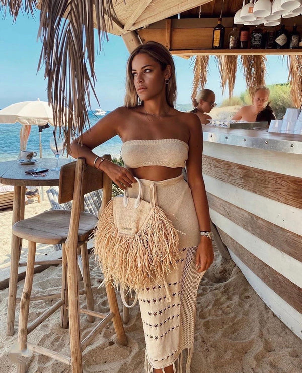 HEIDI COVER UP set is made from a high quality crochet fabric. Featuring a simple, stretch bandeau style top and a maxi style skirt detailed with a leg split and tassel trim. Best worn for cocktails at the beach club with your besties. 